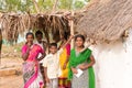 PUTTAPARTHI, ANDHRA PRADESH, INDIA - JULY 9, 2017: Indian family near the house. Copy space for text. Royalty Free Stock Photo