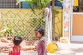 PUTTAPARTHI, ANDHRA PRADESH, INDIA - JULY 9, 2017: Indian girls playing on the street. Copy space for text.