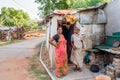 PUTTAPARTHI, ANDHRA PRADESH, INDIA - JULY 9, 2017: Indian women near the building. Copy space for text.