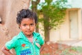 PUTTAPARTHI, ANDHRA PRADESH, INDIA - JULY 9, 2017: Portrait of Indian cute girl on the street. Close-up.