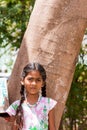 PUTTAPARTHI, ANDHRA PRADESH, INDIA - JULY 9, 2017: Portrait of Indian cute girl on the street. Close-up. Vertical.