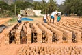PUTTAPARTHI, ANDHRA PRADESH, INDIA - JULY 9, 2017: Production of indian bricks. The brick dries. Copy space for text.