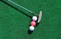 Putter and three golf balls Royalty Free Stock Photo