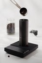 Putting coffee beans into a manual coffee grinder Royalty Free Stock Photo