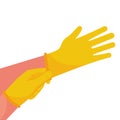 Putting on gloves. Protective latex yellow gloves.