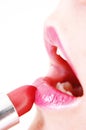 Putting on lip-stick Royalty Free Stock Photo