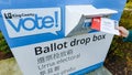 Putting mail-in ballot into King County Washington drop box