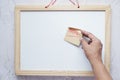 putting a new year goals sticky note on a white board Royalty Free Stock Photo