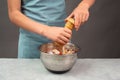 Putting pepper in a pasta salad, sliced mushroom, tomato, red pepper pieces and tuna, healthy food with vegetables, fresh organic Royalty Free Stock Photo