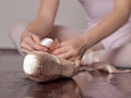 Putting on pointe ballet shoes