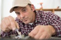 putting screws in kitchen Royalty Free Stock Photo