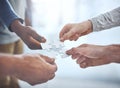 Putting their vision together. Closeup shot of a group of unrecognisable businesspeople holding puzzle pieces together. Royalty Free Stock Photo