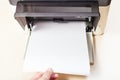 Putting of white paper sheets in printer tray