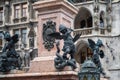 Putto fighting a serpent representing heresy - Mariensaule Sculpture at Marienplatz Square - Munich, Bavaria, Germany Royalty Free Stock Photo