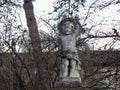 Putto in the garden in a medieval village, Grazzano Visconti, Italy