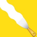 Putty knife on yellow background