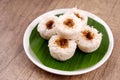 Putu bambu or steamed rice flour cake with grated coconut and palm sugar filling