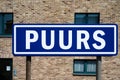 Puurs, Antwerp Province, Belgium - Blue road sign of the village of Puurs