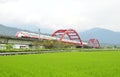 A puyuma train passes through a bridge