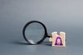 Puzzle with business woman symbol and magnifying glass. search for a new employeeor element in the general plan or strategy