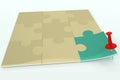 Puzzle composed of beige elements with single unit with green cover in right corner, pinned to surface with red paper push pin.