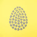 Puzzle egg. Minimal Easter concept on yellow background Royalty Free Stock Photo