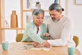 Puzzle, entertainment and happy senior couple in home for bonding, fun activity and relax together. Retirement, love and Royalty Free Stock Photo