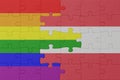 puzzle with the flag of rainbow gay pride and austria . macro.concept Royalty Free Stock Photo