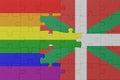 puzzle with the flag of rainbow gay pride and basque country . macro.concept Royalty Free Stock Photo