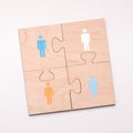 Puzzle of four pieces with people who connecting for helping Royalty Free Stock Photo