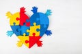 Puzzle heart hands support autism awareness Royalty Free Stock Photo