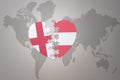 puzzle heart with the national flag of austria and england on a world map background.Concept Royalty Free Stock Photo