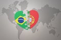 Puzzle heart with the national flag of brazil and portugal on a world map background.Concept Royalty Free Stock Photo