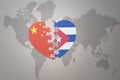 Puzzle heart with the national flag of china and cuba on a world map background. Concept Royalty Free Stock Photo