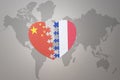 Puzzle heart with the national flag of china and france on a world map background. Concept Royalty Free Stock Photo