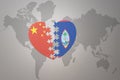 Puzzle heart with the national flag of china and guam on a world map background. Concept Royalty Free Stock Photo