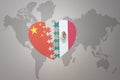 Puzzle heart with the national flag of china and mexico on a world map background. Concept Royalty Free Stock Photo