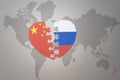 Puzzle heart with the national flag of china and russia on a world map background. Concept Royalty Free Stock Photo