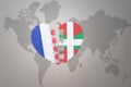 Puzzle heart with the national flag of france and basque country on a world map background. Concept Royalty Free Stock Photo