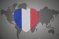 Puzzle heart with the national flag of france on a world map background Royalty Free Stock Photo