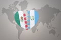 Puzzle heart with the national flag of guatemala and mexico on a world map background.Concept Royalty Free Stock Photo