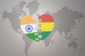 Puzzle heart with the national flag of india and bolivia on a world map background.Concept