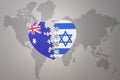 Puzzle heart with the national flag of israel and australia on a world map background. Concept Royalty Free Stock Photo