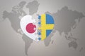 Puzzle heart with the national flag of japan and sweden on a world map background. Concept. 3D illustration Royalty Free Stock Photo