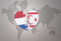 Puzzle heart with the national flag of northern cyprus and netherlands on a world map background.Concept Royalty Free Stock Photo