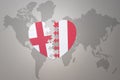 puzzle heart with the national flag of peru and england on a world map background.Concept