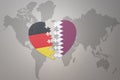 Puzzle heart with the national flag of qatar and germany on a world map background. Concept