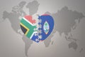 Puzzle heart with the national flag of south africa and guam on a world map background. 3D illustration