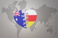 Puzzle heart with the national flag of south ossetia and australia on a world map background. Concept Royalty Free Stock Photo