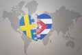 Puzzle heart with the national flag of sweden and cuba on a world map background. Concept